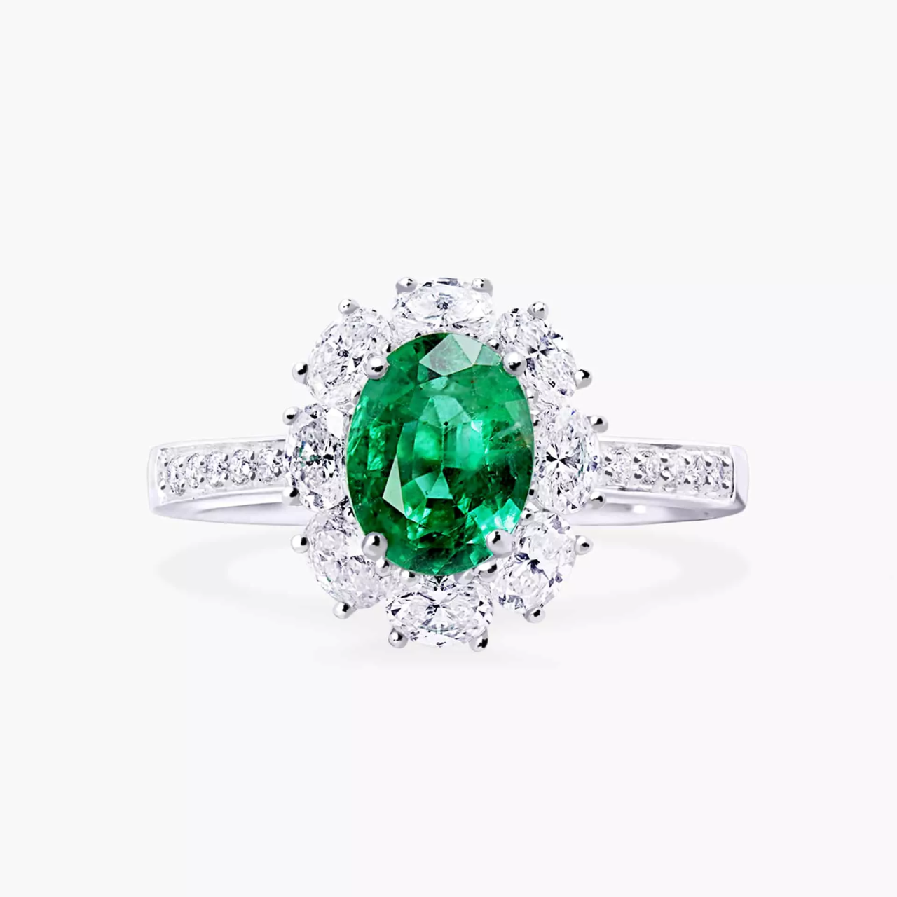 18ct white gold 1.12ct oval Emerald and round brilliant cut diamond halo ring