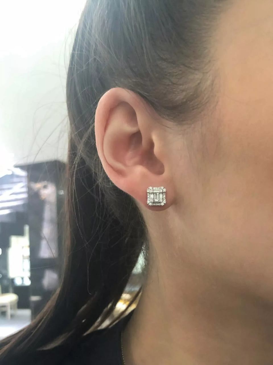 18ct white gold claw set baguette & round brilliant cut diamond stud earrings on the ear