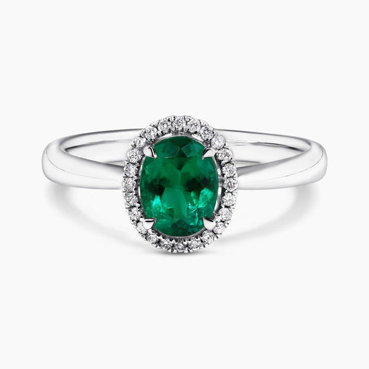 18ct white gold 0.93ct oval cut emerald and round brilliant cut diamonds claw set ring