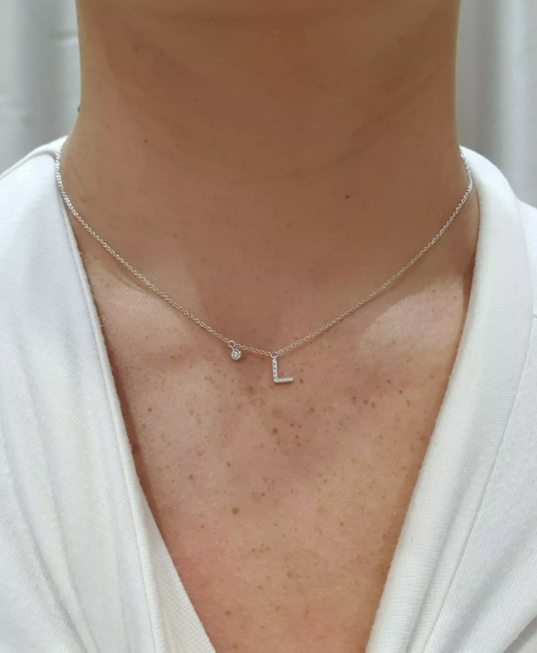 18ct white gold diamond set initial “L” necklace