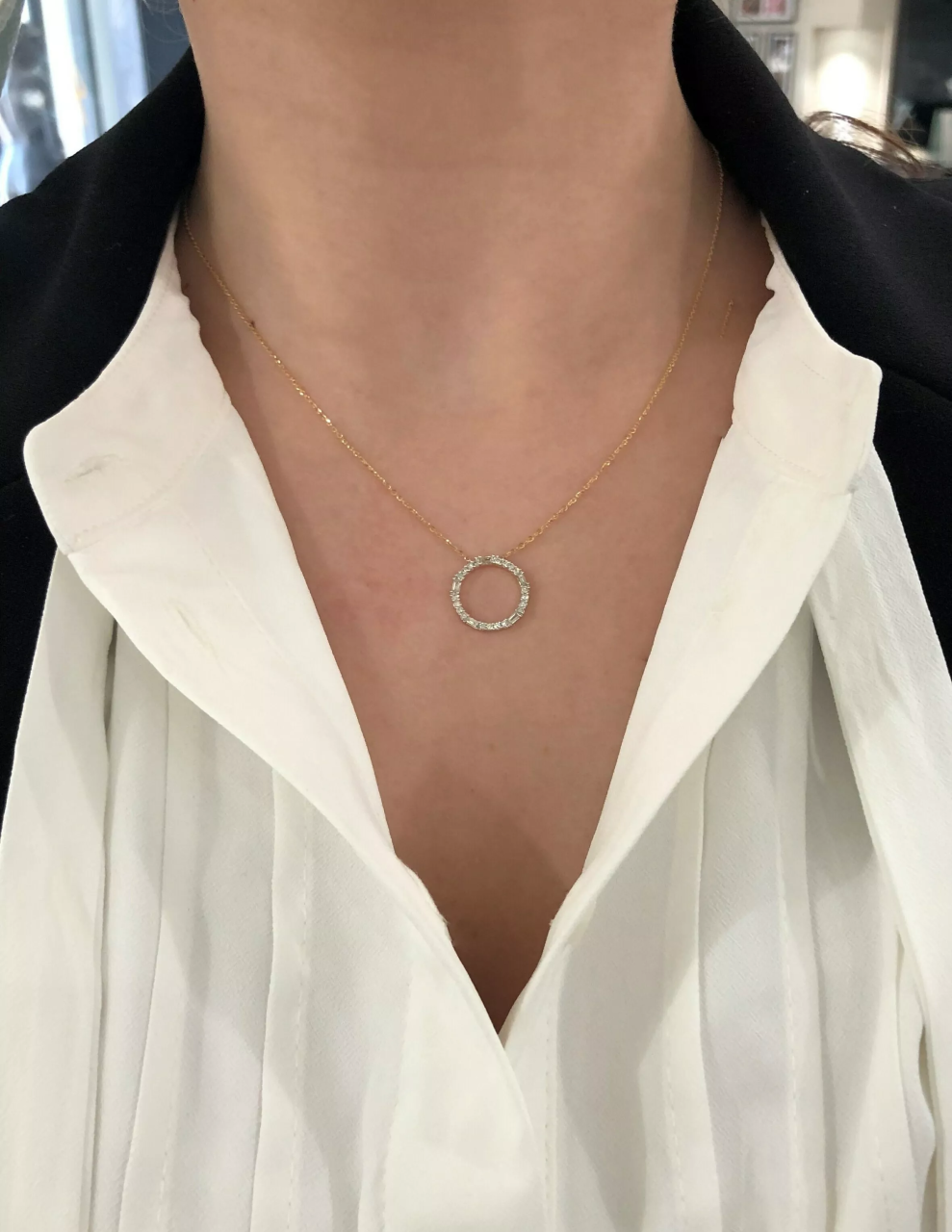 18ct yellow gold baguette and round diamond circle necklace on the neck