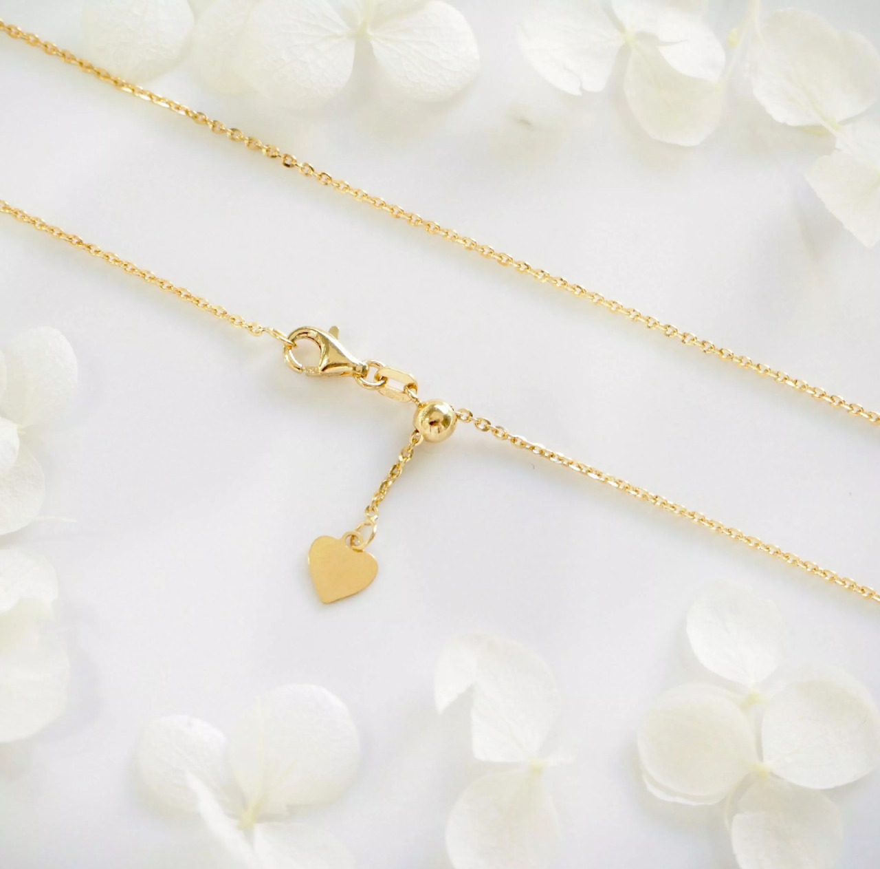 18ct yellow gold 50cm adjustable diamond cut chain