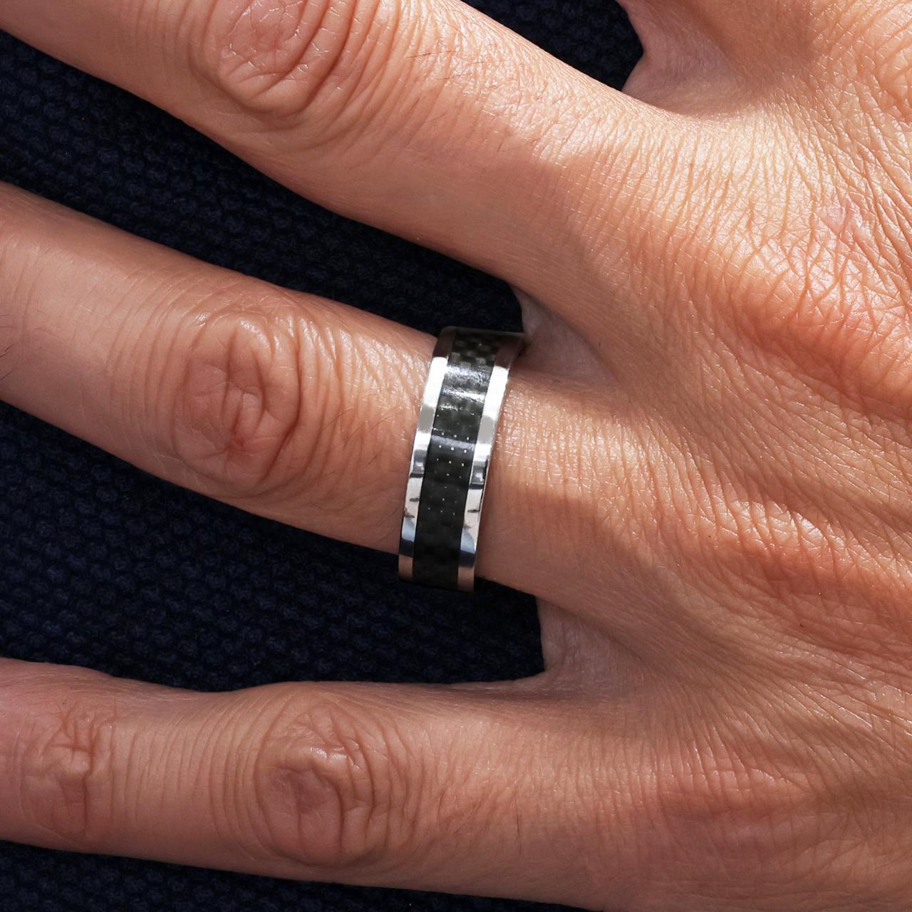 Polished stainless steel ring with carbon fiber inlay