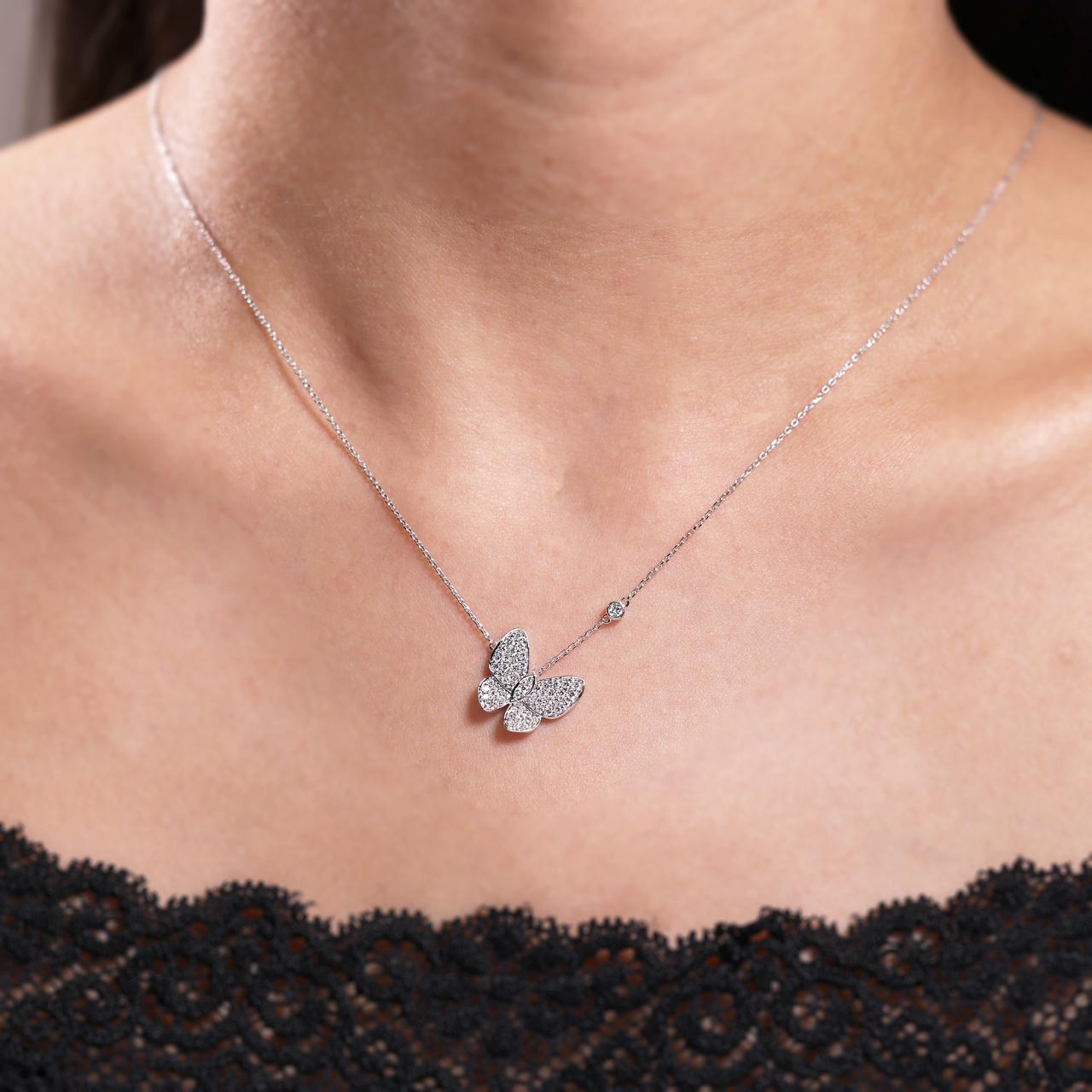 18ct white gold diamond set butterfly necklace with bezel set single diamond on the neck