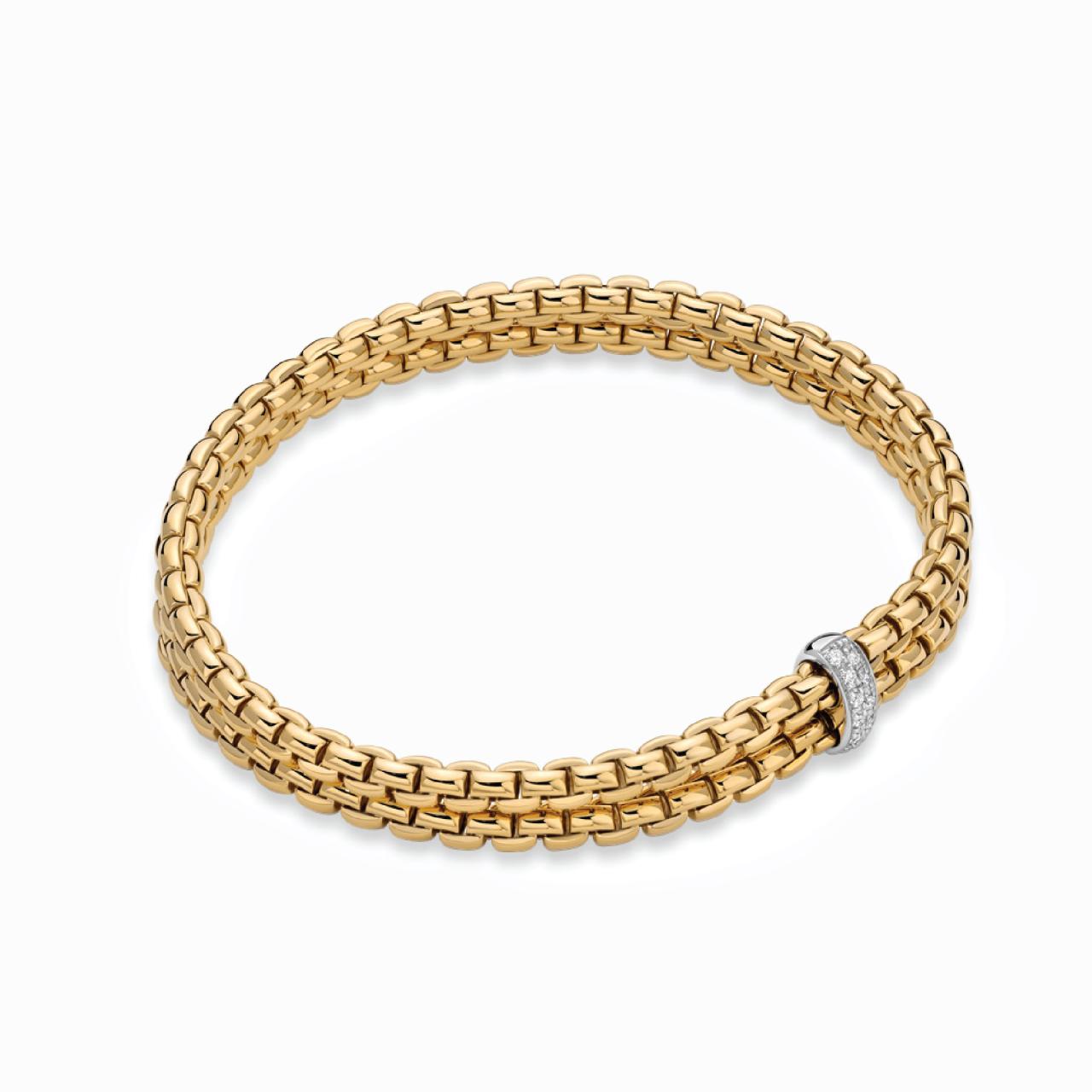 18ct yellow gold flexible 'FOPE' bracelet with an 18ct white gold diamond set rondel