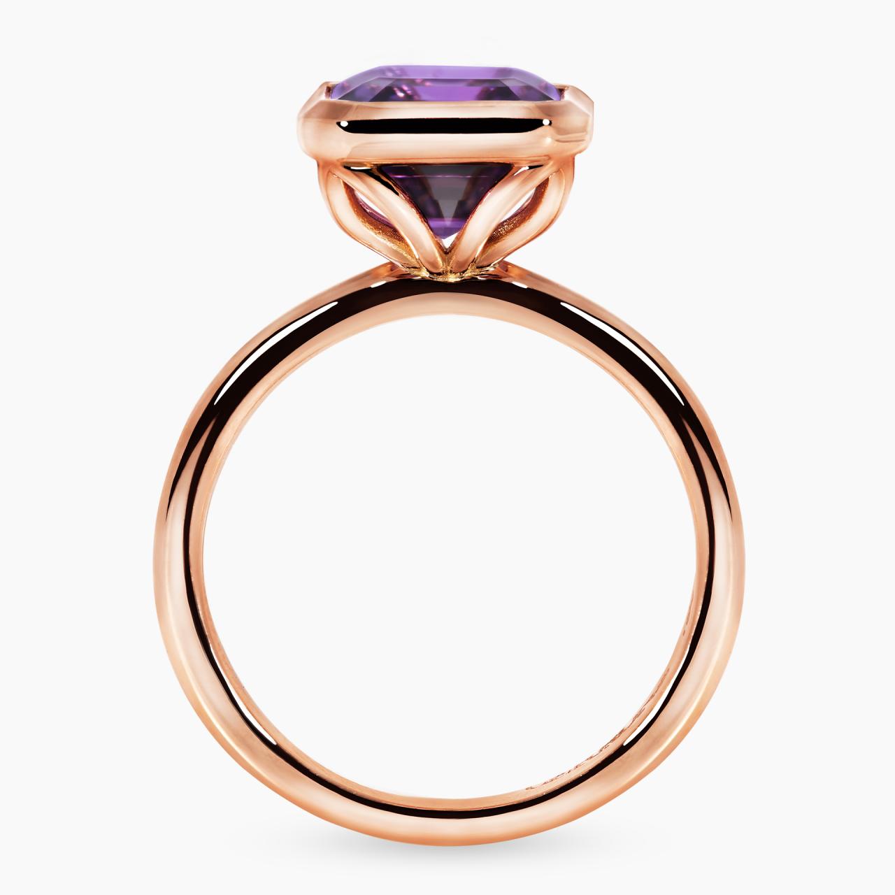 18ct rose gold 3.05ct emerald cut amethyst ring in a bezel setting