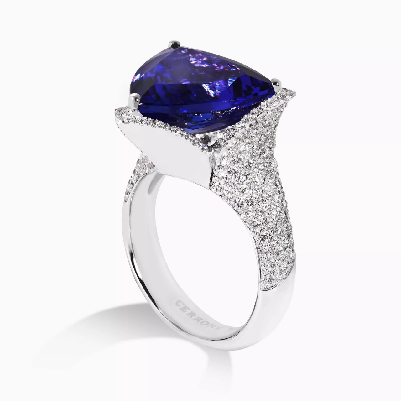 18ct white gold 8.09ct trilliant cut Tanzanite and pave set round brilliant cut diamond ring