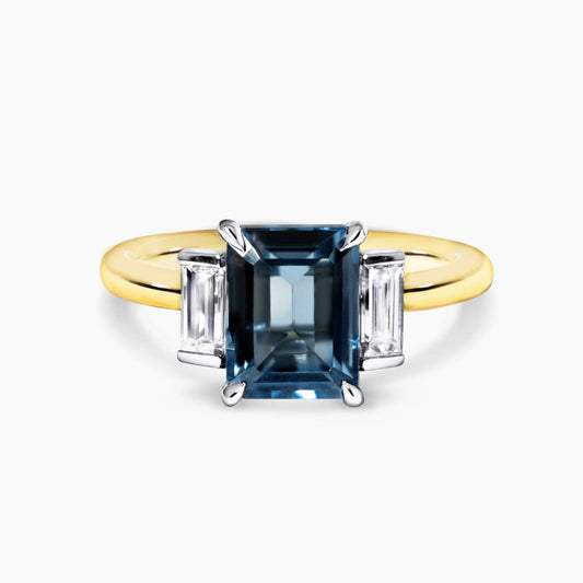 18ct yellow and white gold 3.08ct emerald cut London blue topaz and baguette cut diamond ring
