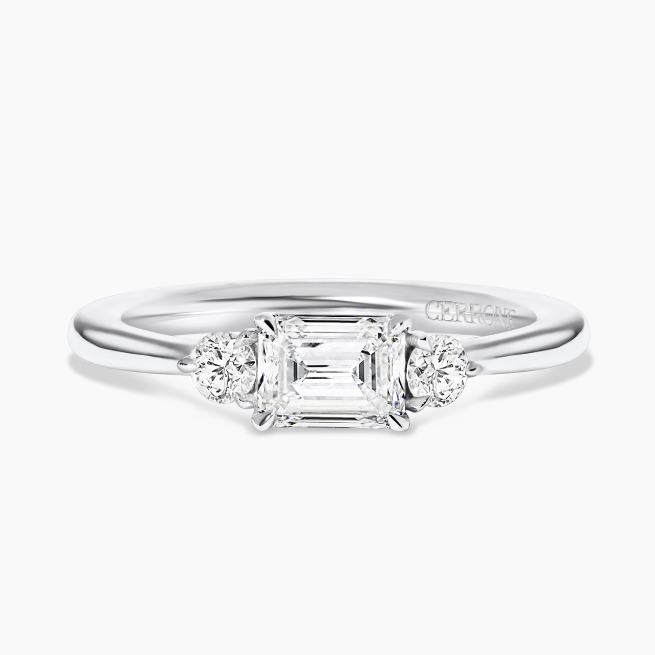 18ct white gold emerald and round brilliant cut diamond ring