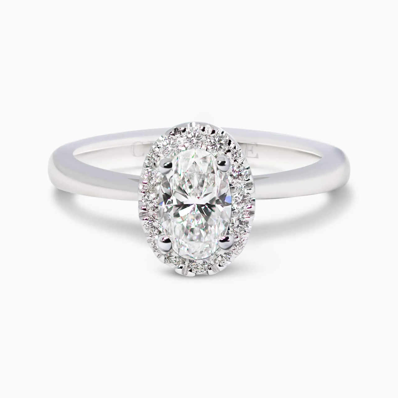 18ct white gold oval and round brilliant cut diamond halo ring