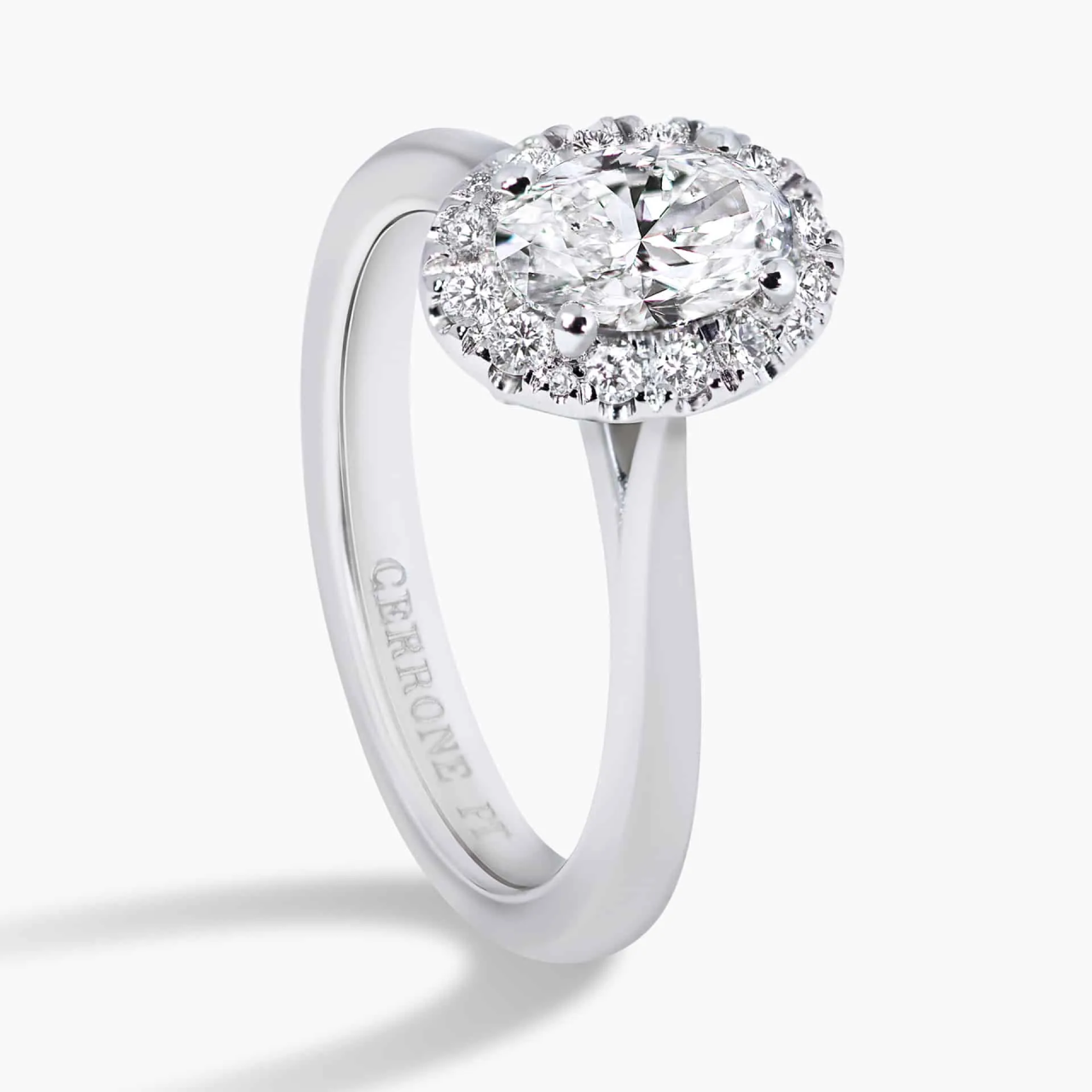 18ct white gold oval and round brilliant cut diamond halo ring