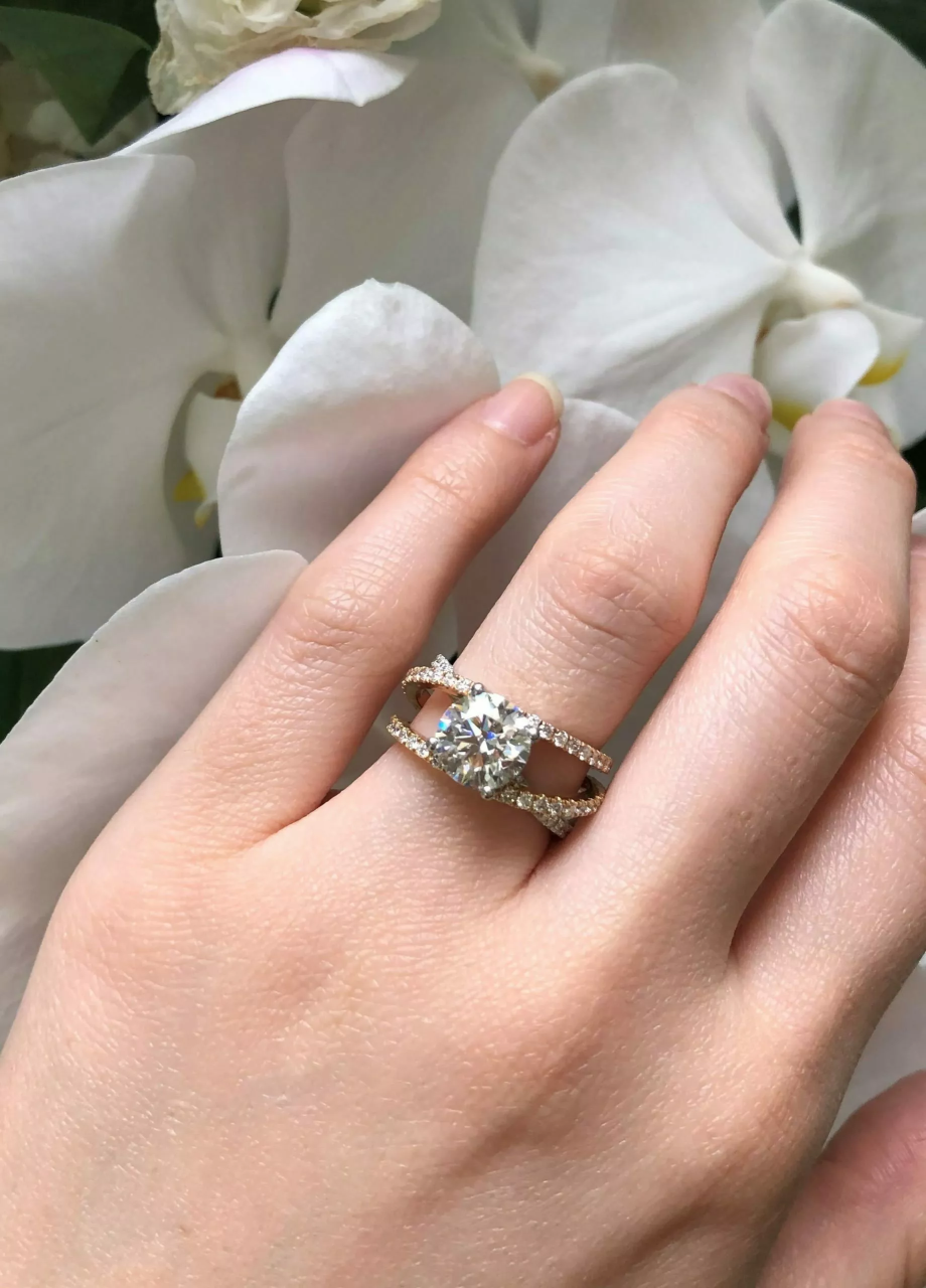 18ct white, yellow and rose gold round brilliant cut diamond cross over ring on finger