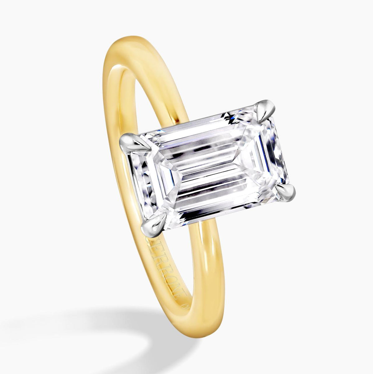 POSITANO 18ct yellow and white gold emerald cut lab grown diamond solitaire engagement ring in a four claw setting side view