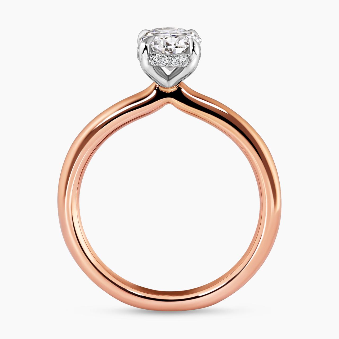 18ct rose and white gold oval brilliant cut diamond with round brilliant cut diamond hidden halo side profile