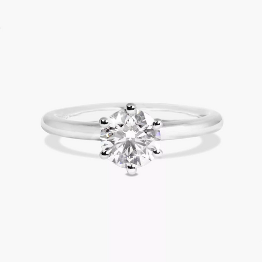 CAPRI - Platinum round brilliant cut diamond six claw solitaire ring.