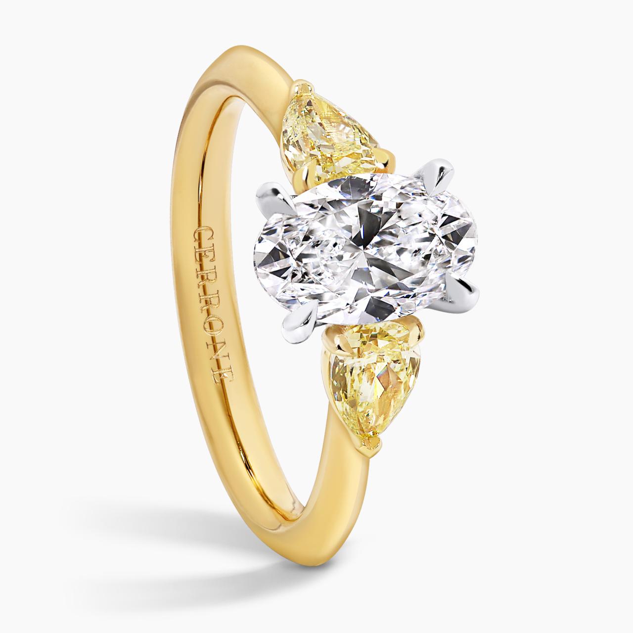 18ct yellow and white gold 1.20ct oval shape and pear shaped diamonds ring