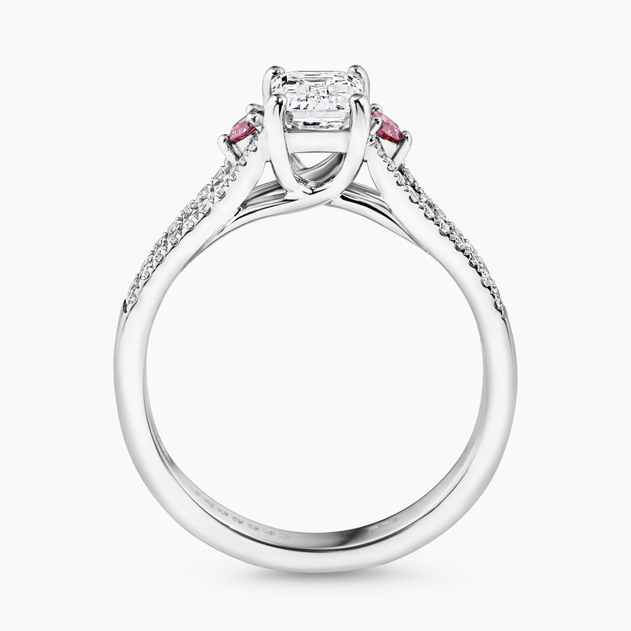 18ct white gold emerald cut diamond ring featuring round pink diamonds with split band side profile