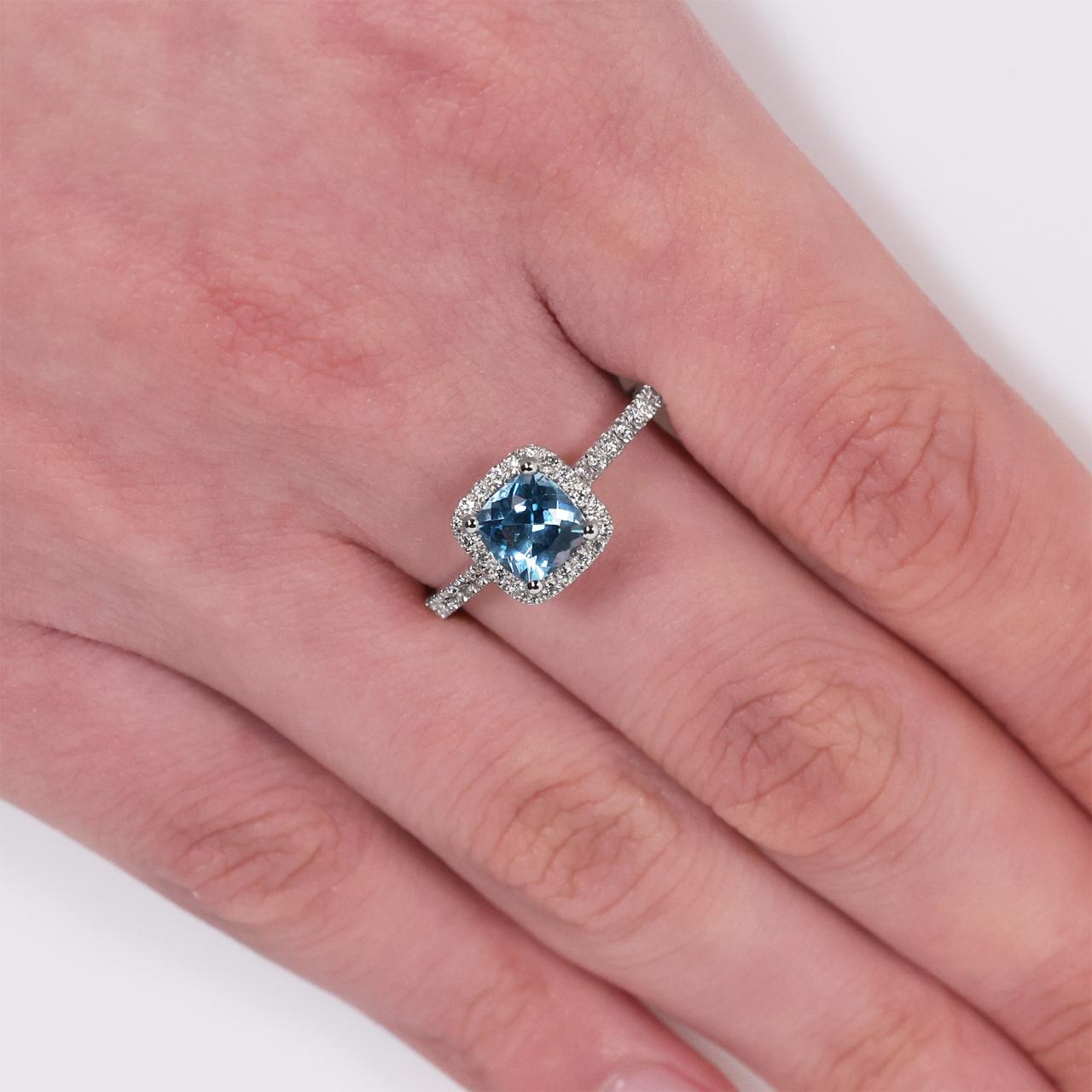 18ct white gold 1.25ct blue topaz cushion cut and diamond ring