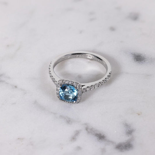 18ct white gold 1.25ct blue topaz cushion cut and diamond ring