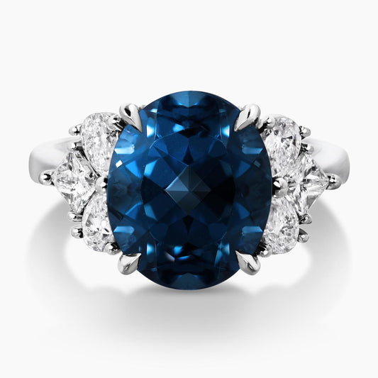 18ct white gold 6.09ct oval shape London blue topaz and diamond ring with pear, princess and round brilliant cut diamonds