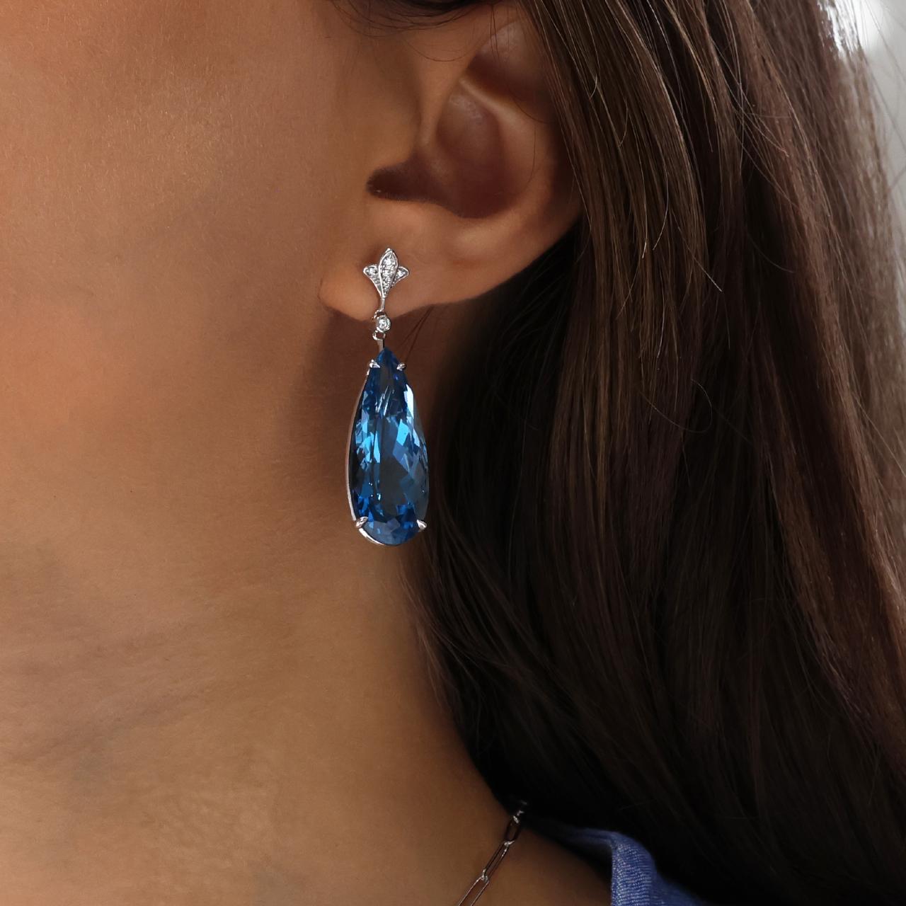 18ct white gold diamond and 2=46.10ct pear shaped London blue topaz drop earrings