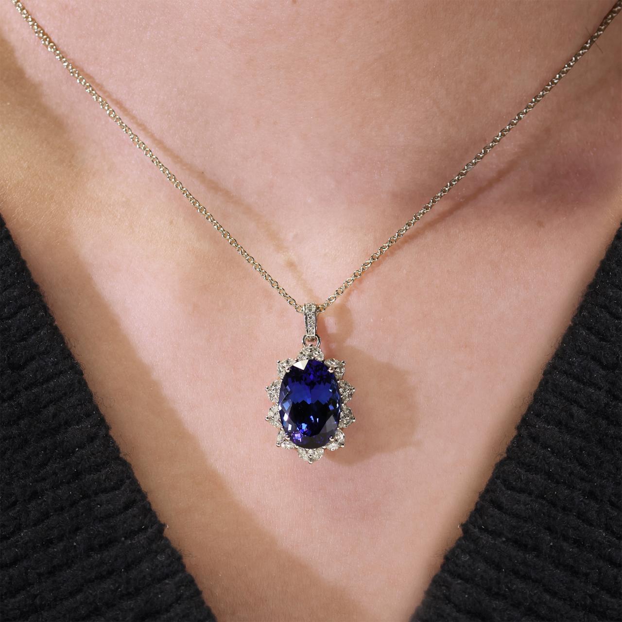 18ct white gold 8.14ct oval cut Tanzanite and 0.58ct round brilliant cut diamond claw set pendant on 18ct white gold trace chain