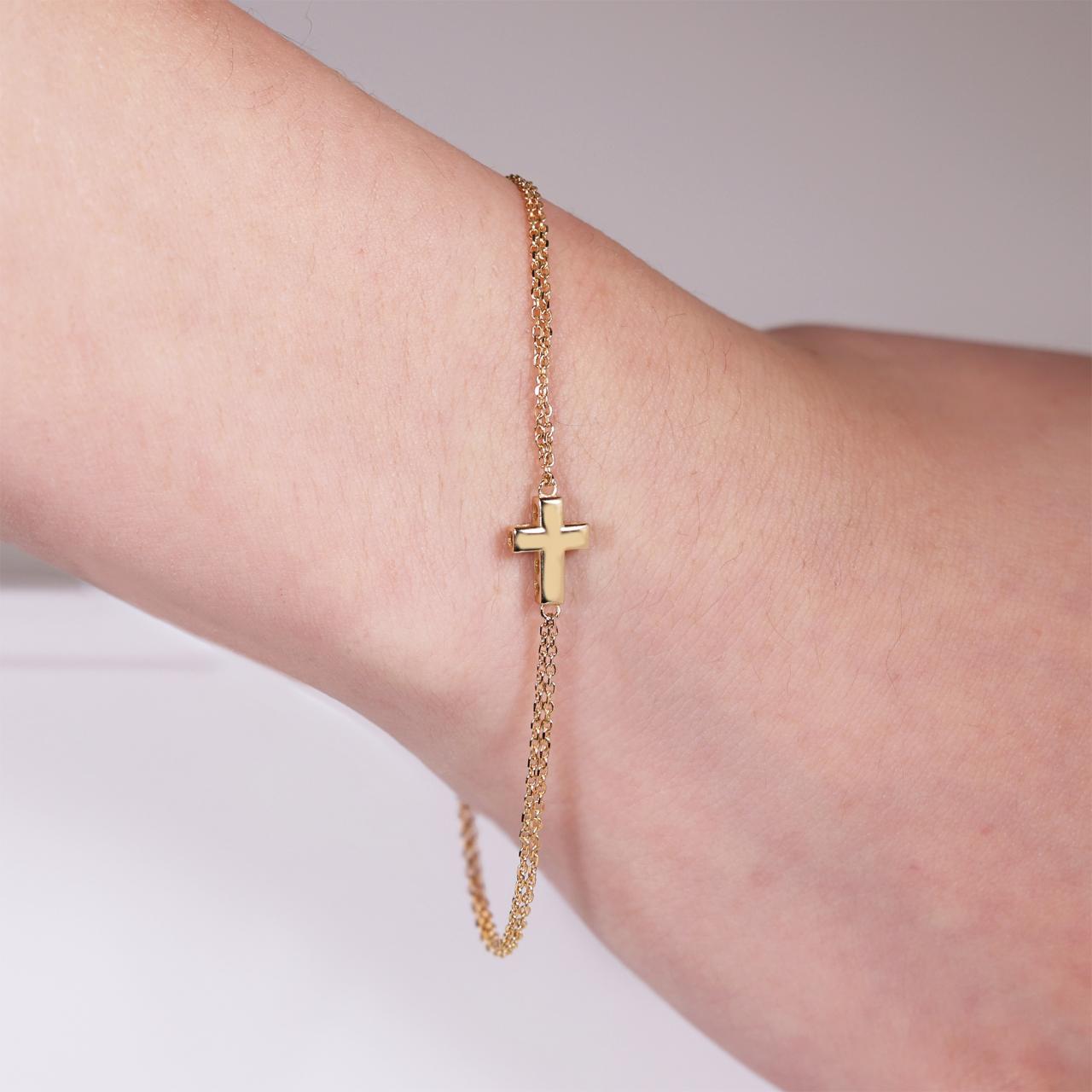 18ct yellow gold hollow cross adjustable bracelet on the wrist