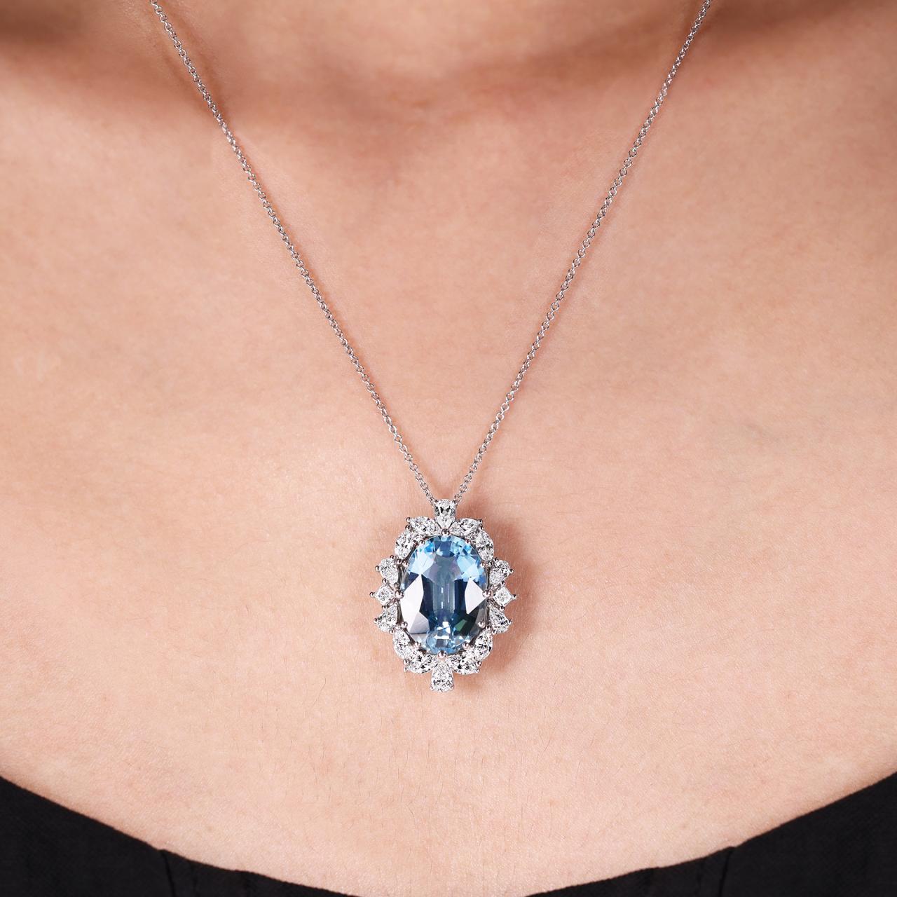 18ct white gold oval shaped aquamarine and diamond necklace on the neck