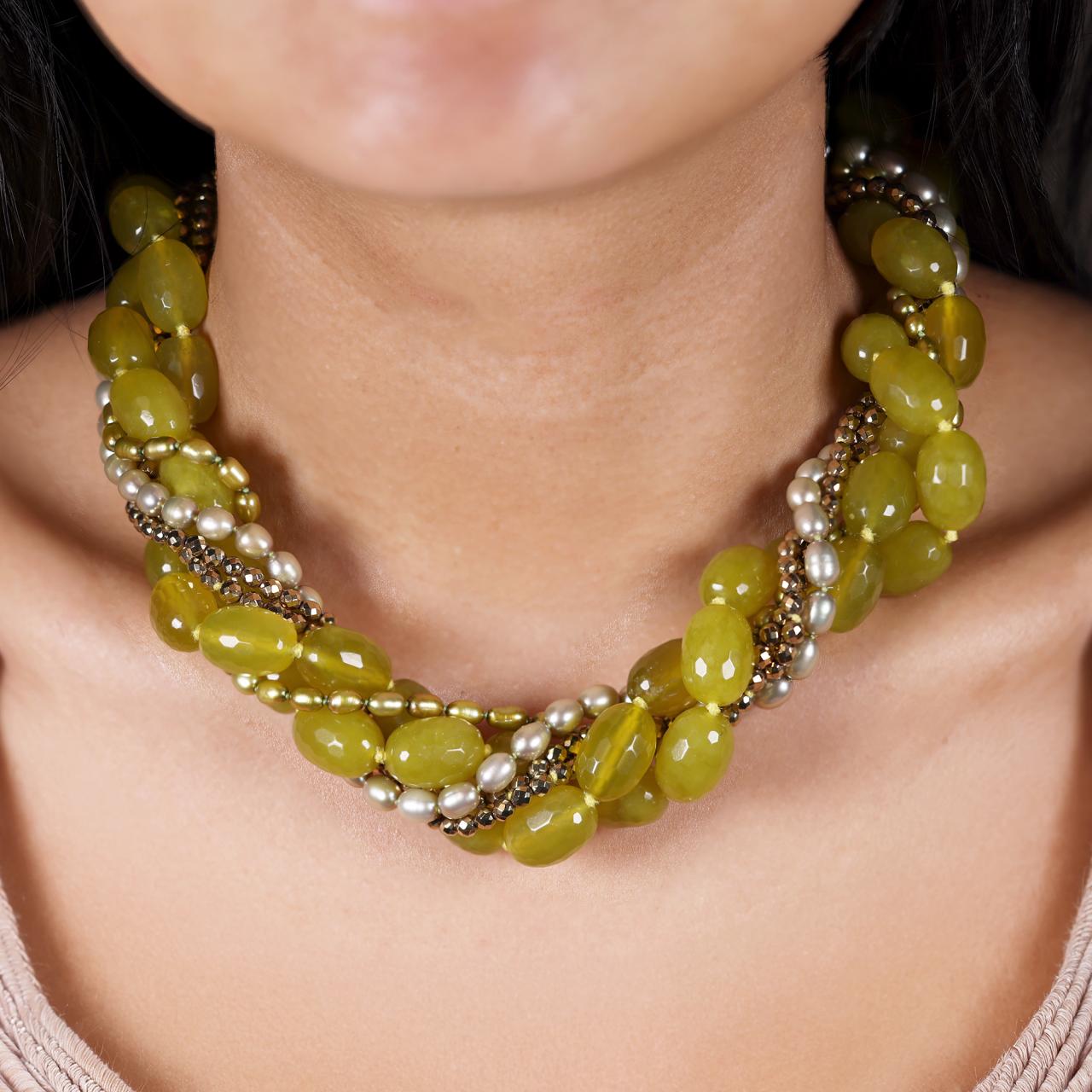Two rows of green fresh water pearls, two rows of korean jade and two rows of gold plated hemitite beads necklace on the neck
