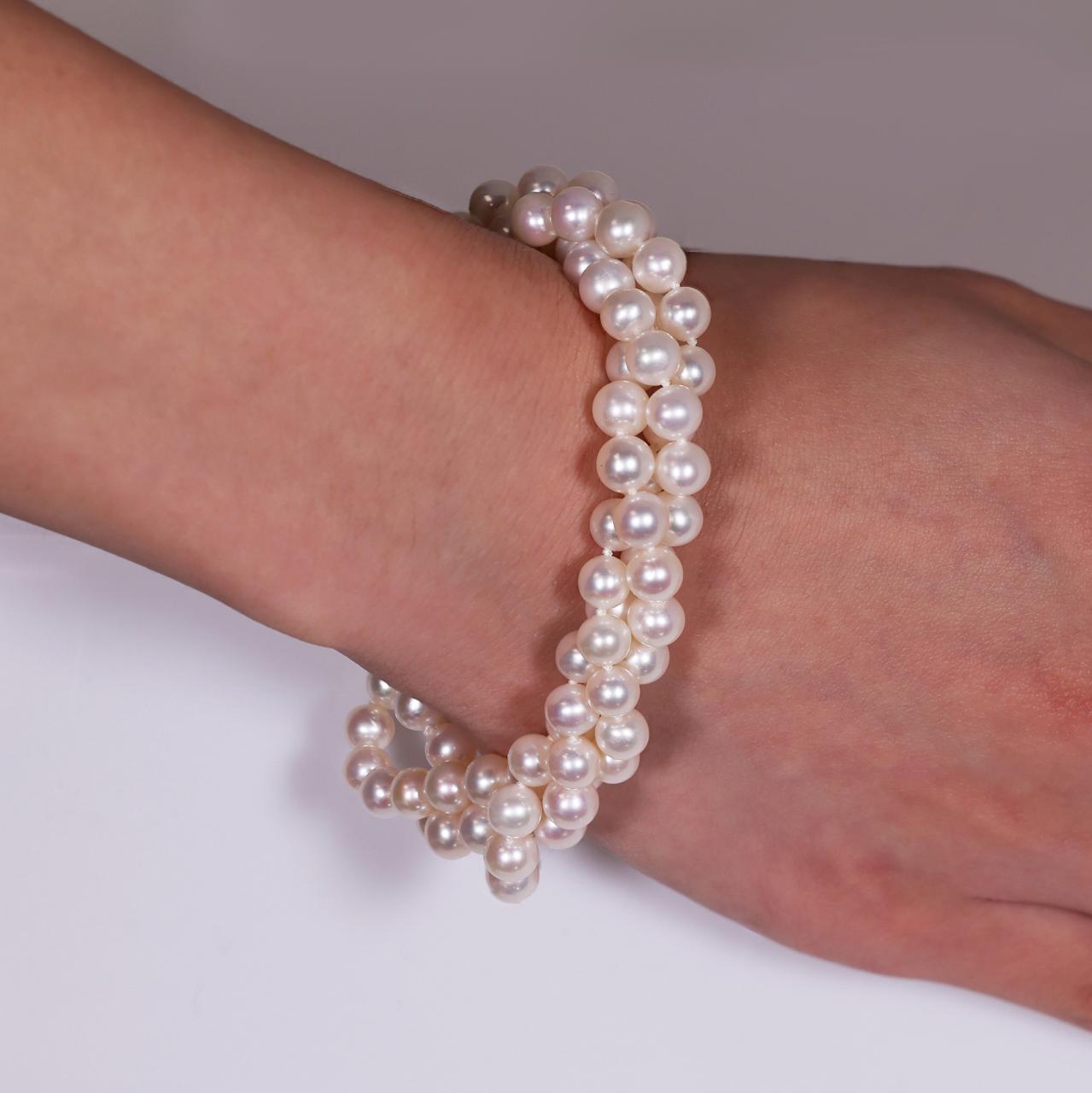 Fresh water three strands 6mm pearl bracelet from Carmela Cerrone collection features magnetic ball clasp on the wrist