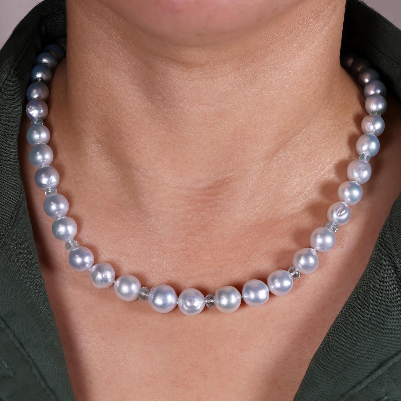 One row of semi baroque South Sea pearls, aquamarine beads necklace on the neck