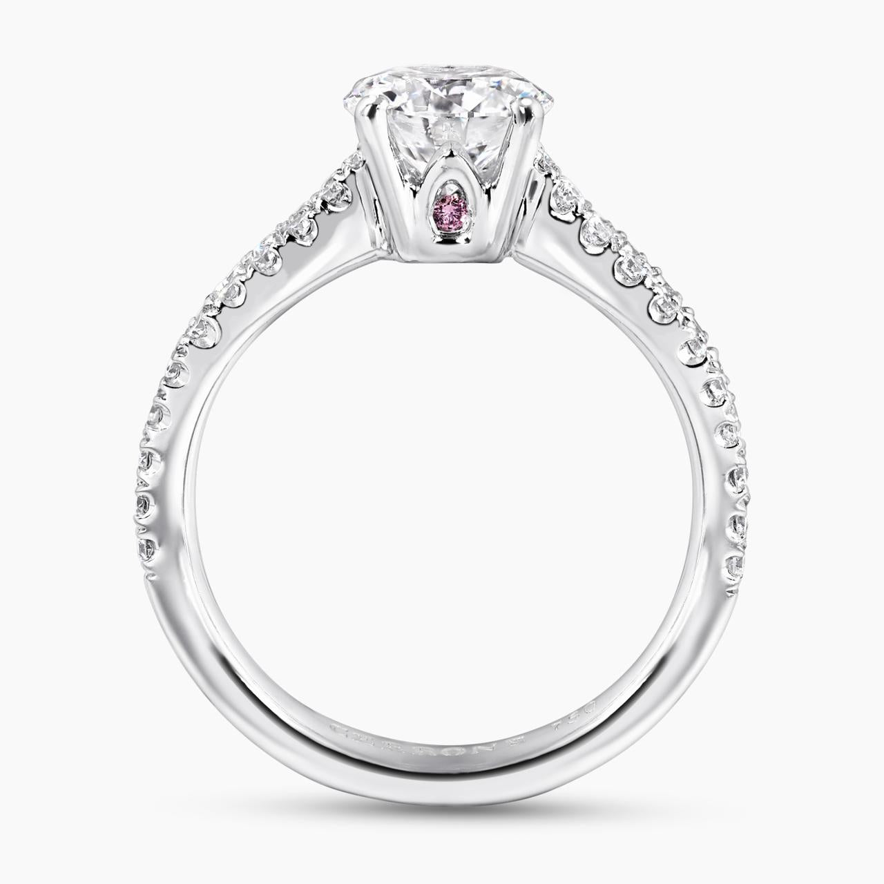 18ct white gold round brilliant cut diamond ring featuring round fancy pink diamonds side profile
