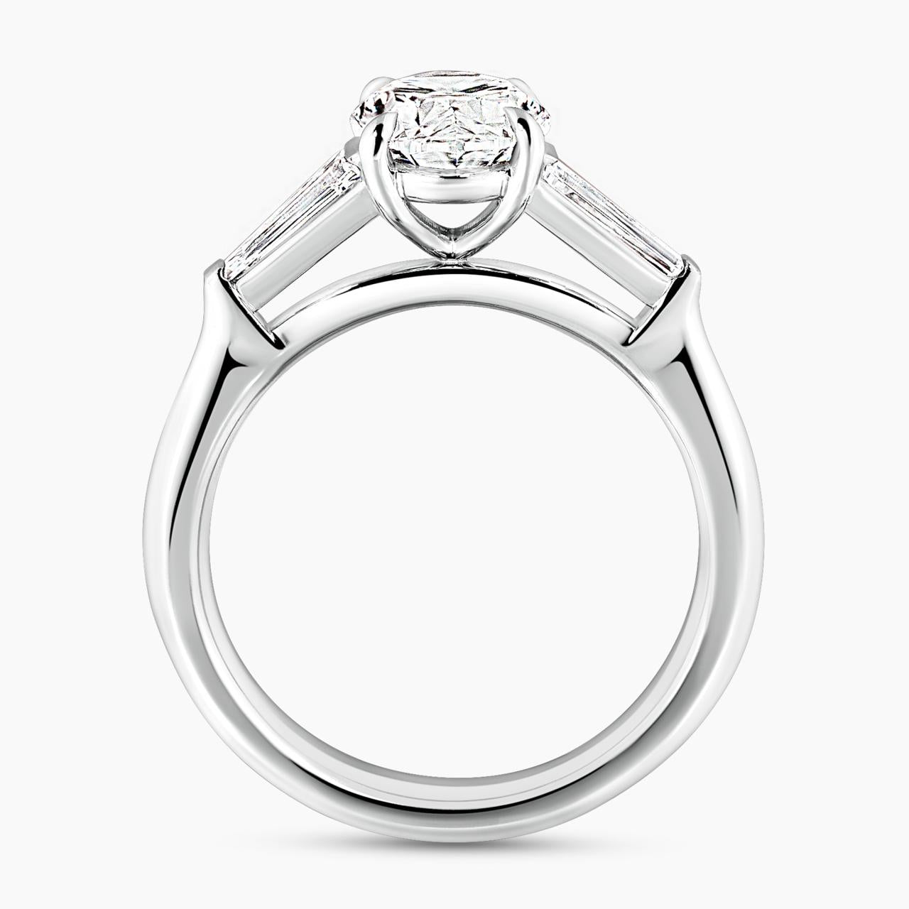 18ct white gold 1.80ct oval brilliant cut diamond ring features 2=0.46ct tapered baguette diamonds side profile