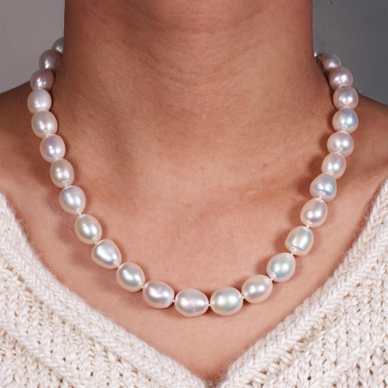 Fresh water 11mm rice shape pearls necklace with a rhodium plated silver magnetic clasp