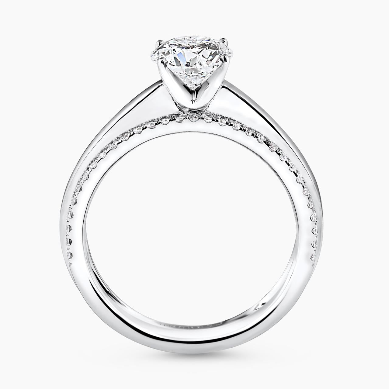 18ct white gold 1.02ct round brilliant cut diamond ring in a four claw setting with RBC diamonds in pave setting