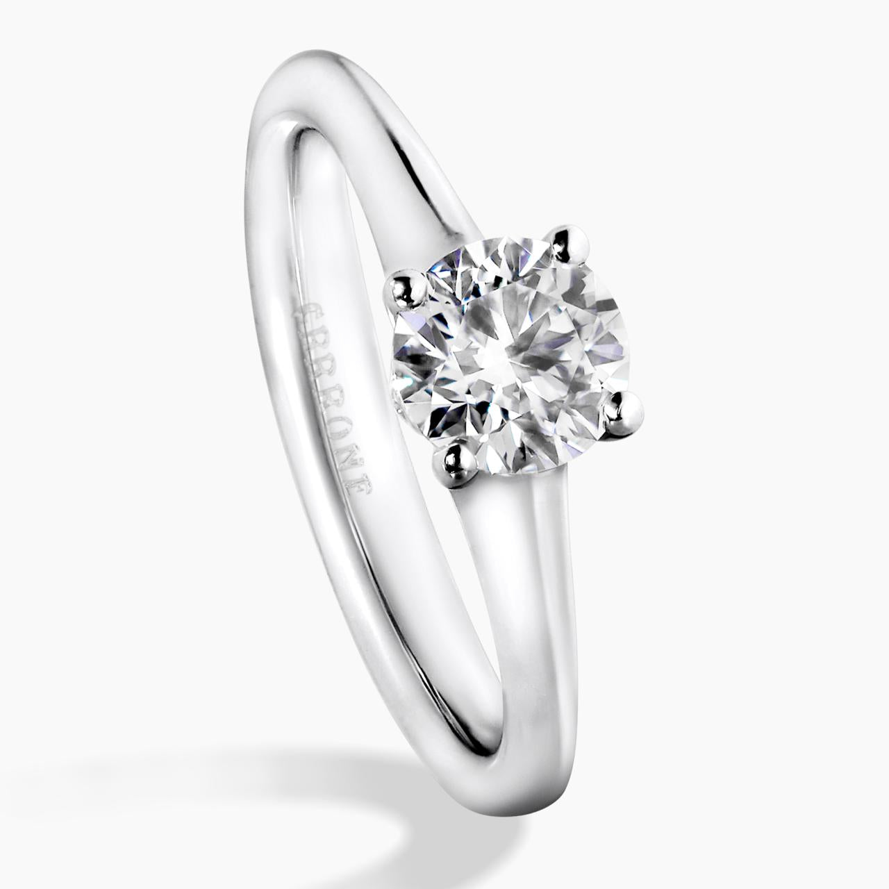 Platinum and rose gold round brilliant cut diamond engagement ring featuring pink round brilliant cut diamonds on the side