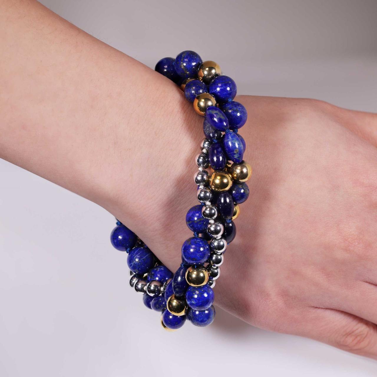 Three rows of mixed lapis lazuli and gold plated hematite beads and one row with silver plated hematite beads bracelet ended with a silver magnetic clasp