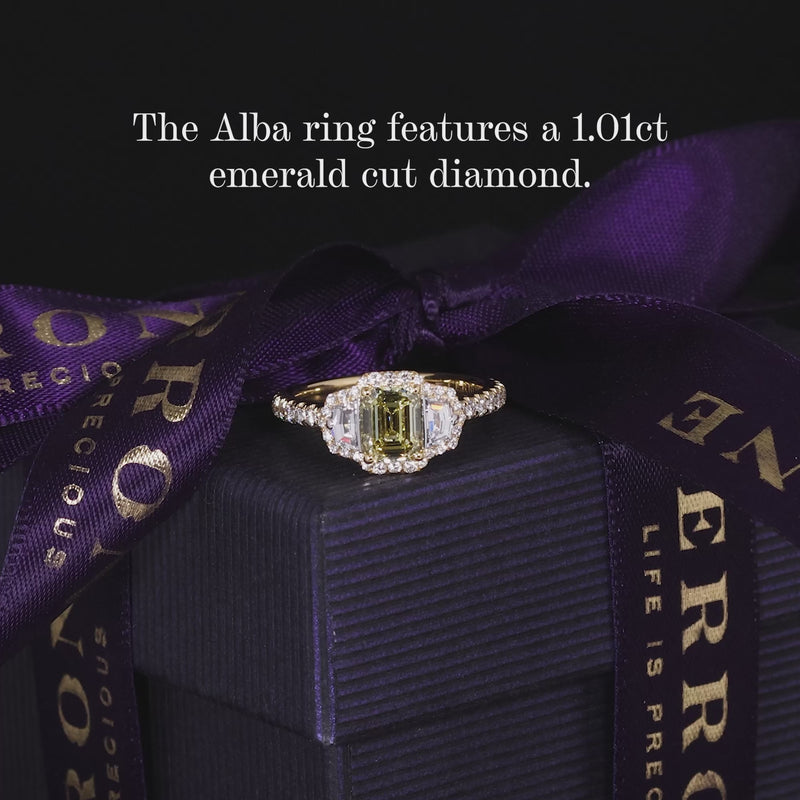 18ct yellow gold Fancy Intense Yellow emerald cut diamond engagement ring with cadillac step cut diamonds on the side
