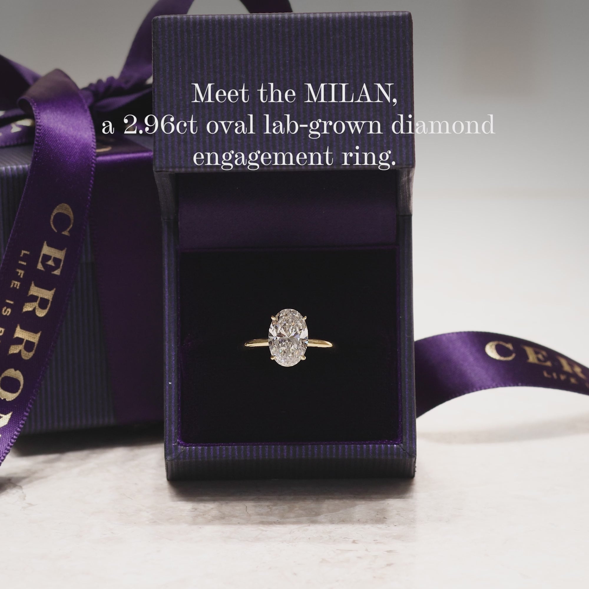 MILAN 18ct yellow gold oval lab grown diamond ring in a four claw setting with hidden halo video