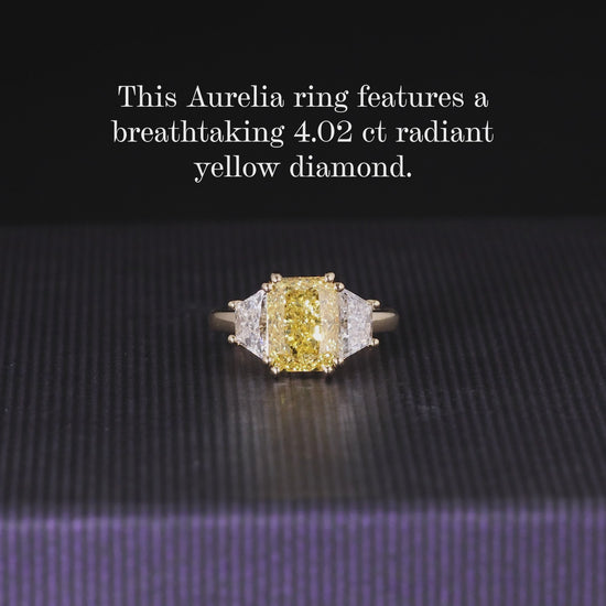 18ct yellow gold Fancy Vivid Yellow radiant LAB Grown diamond engagement ring with trapezoid Lab Grown diamonds 