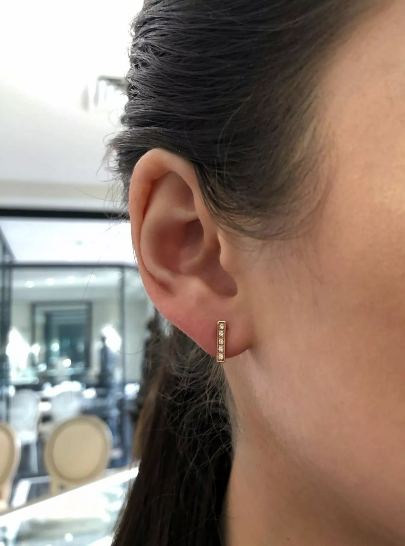 18ct rose gold diamond bar stud earrings on ear