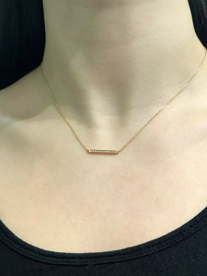 18ct rose gold diamond bar necklace on neck