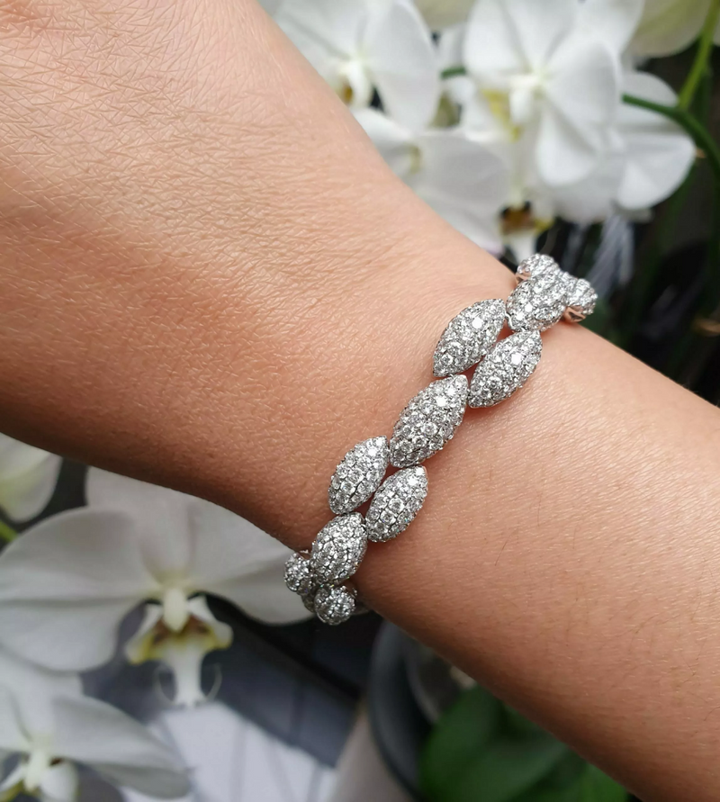 18ct White Gold round brilliant cut diamonds pave leaf shaped bracelet on the wrist