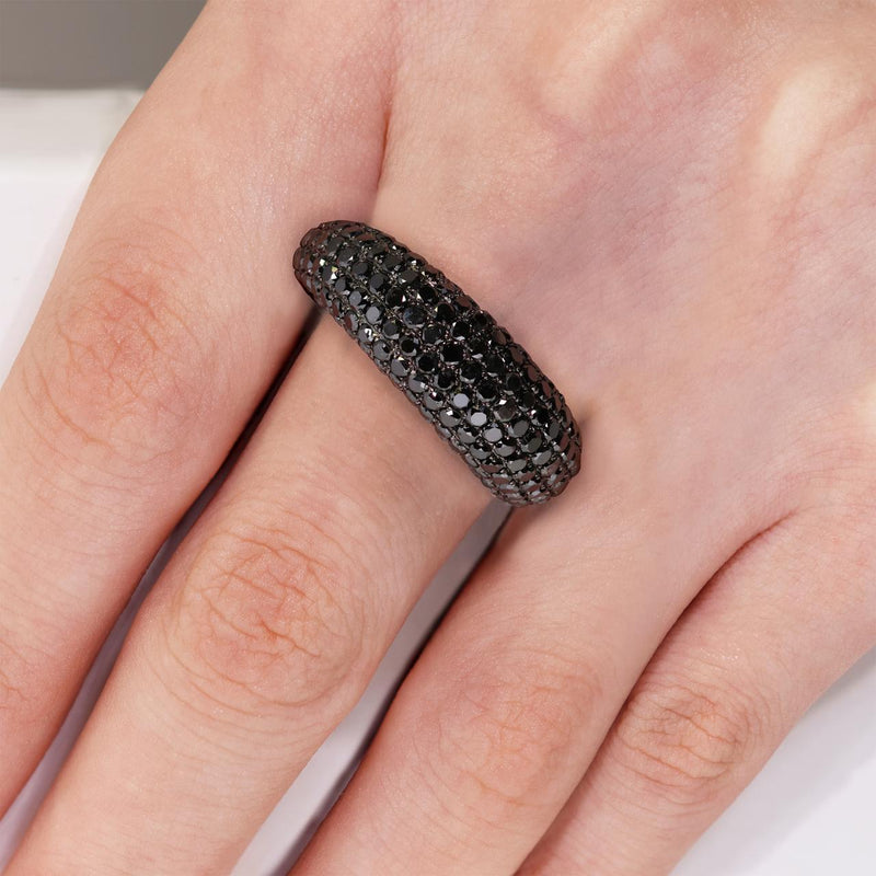 18ct black gold round brilliant cut black diamond ring on the finger
