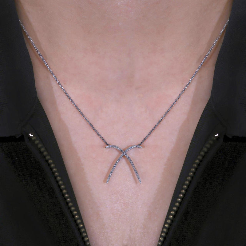 18ct white gold 0.18ct diamond cross necklace on neck