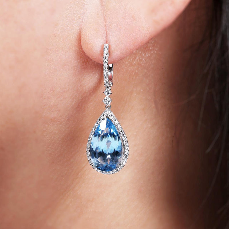 18ct white gold pear shape aquamarines and diamond drop earrings on the ear
