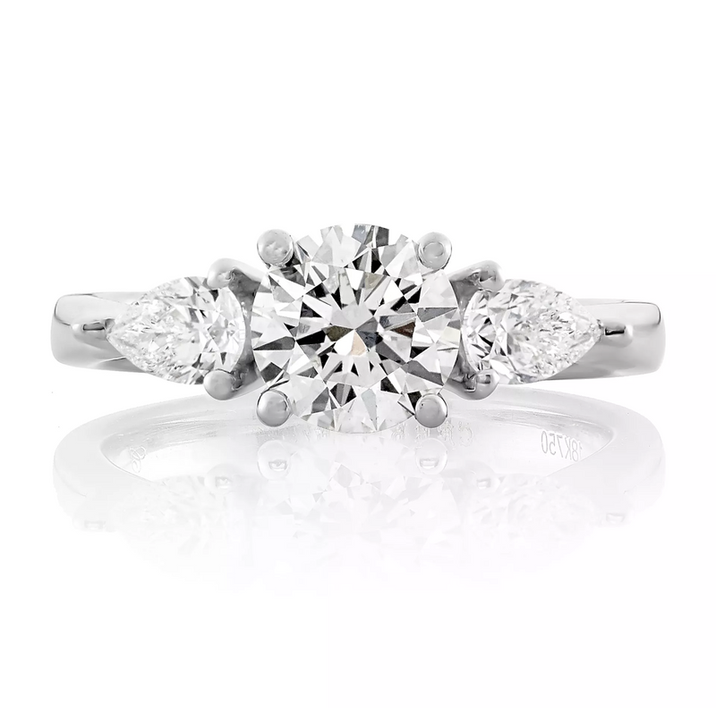 18ct white gold round brilliant and pear cut diamond trilogy ring