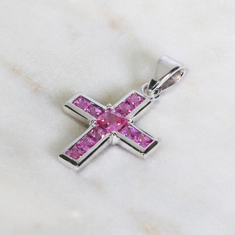 18ct white gold cross pendant with channel set pink sapphires