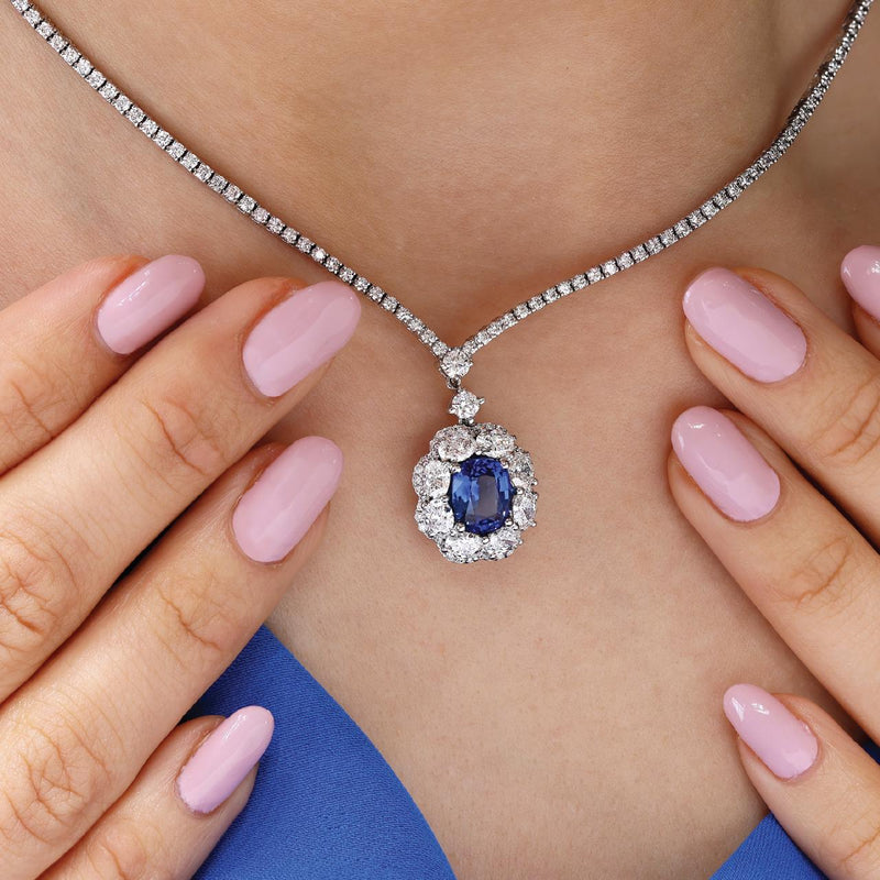 18ct white gold oval ceylon sapphire & diamond drop necklace on neck