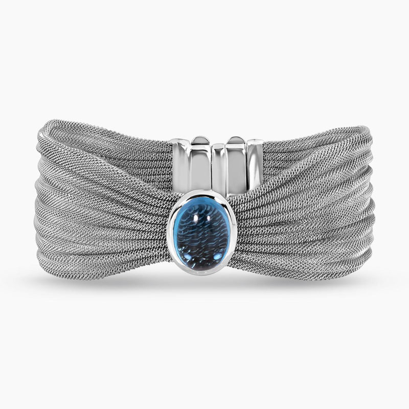 18ct white gold blue topaz bangle features cabochon blue topaz in bezel setting